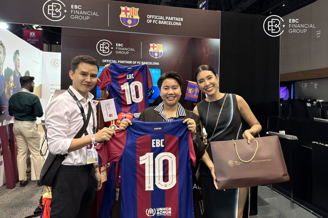 Three individuals display the FC Barcelona jersey